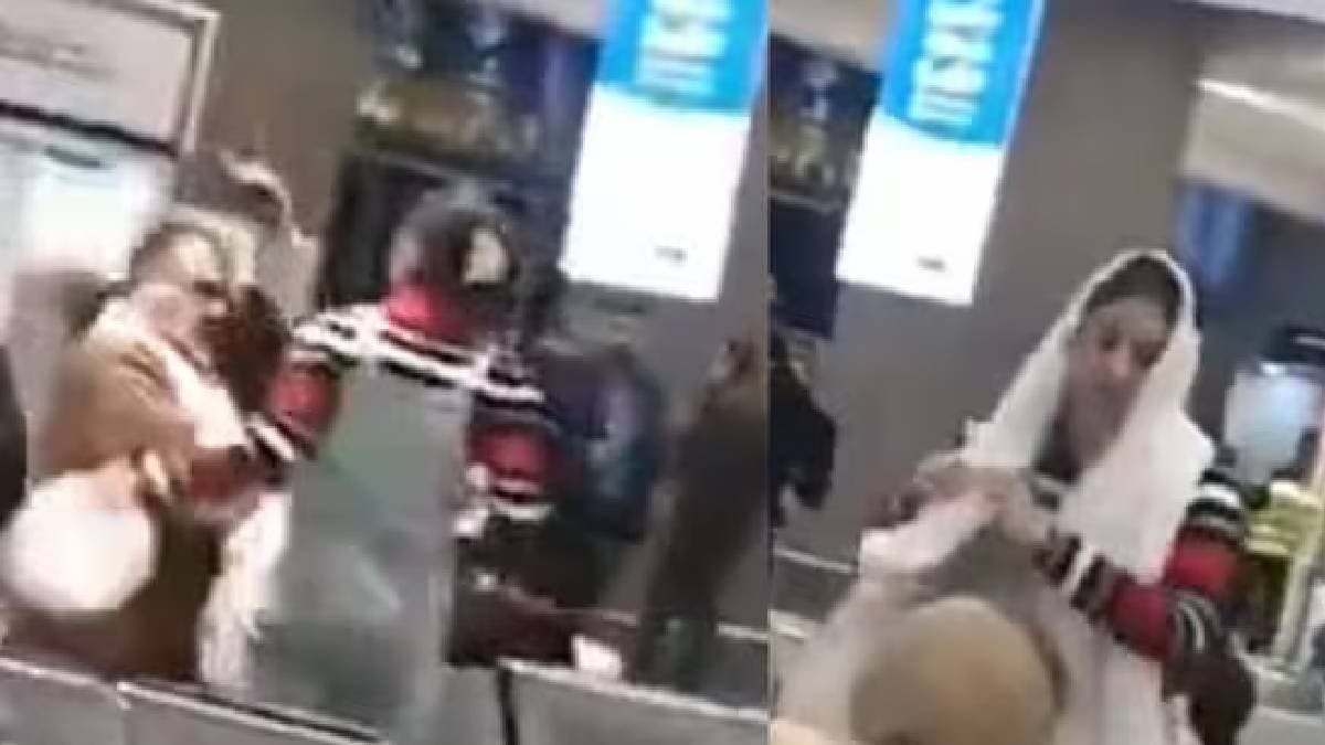 iranian woman snatches clerics turban uses it as hijab in act of defiance