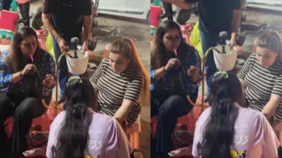 Women Get Mehendi Done As They Smoke Hookah On Road 