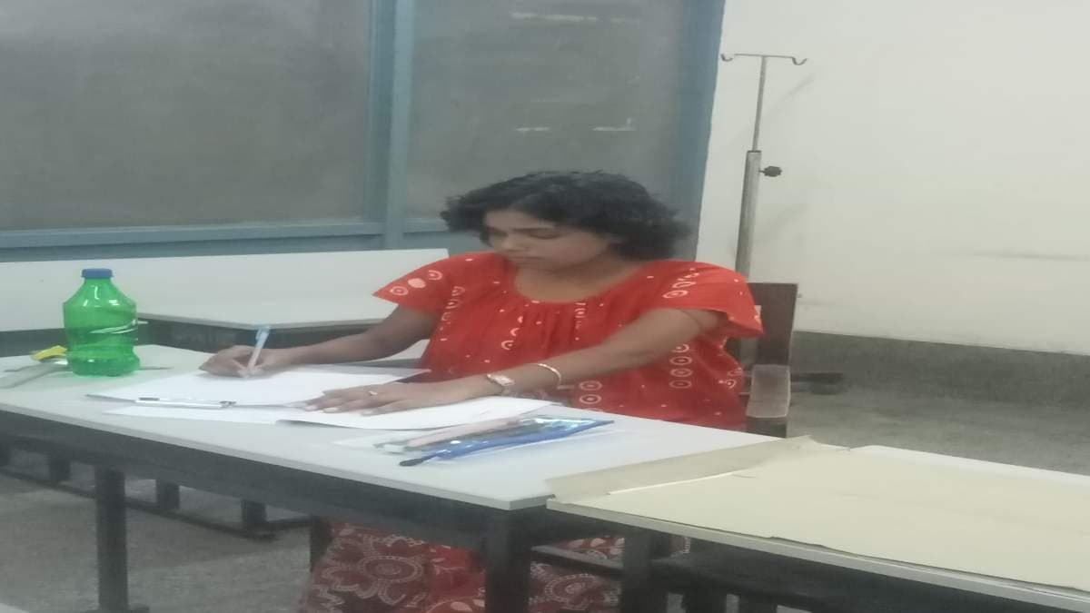 Cancer patient seats for exam from NRS Hospital