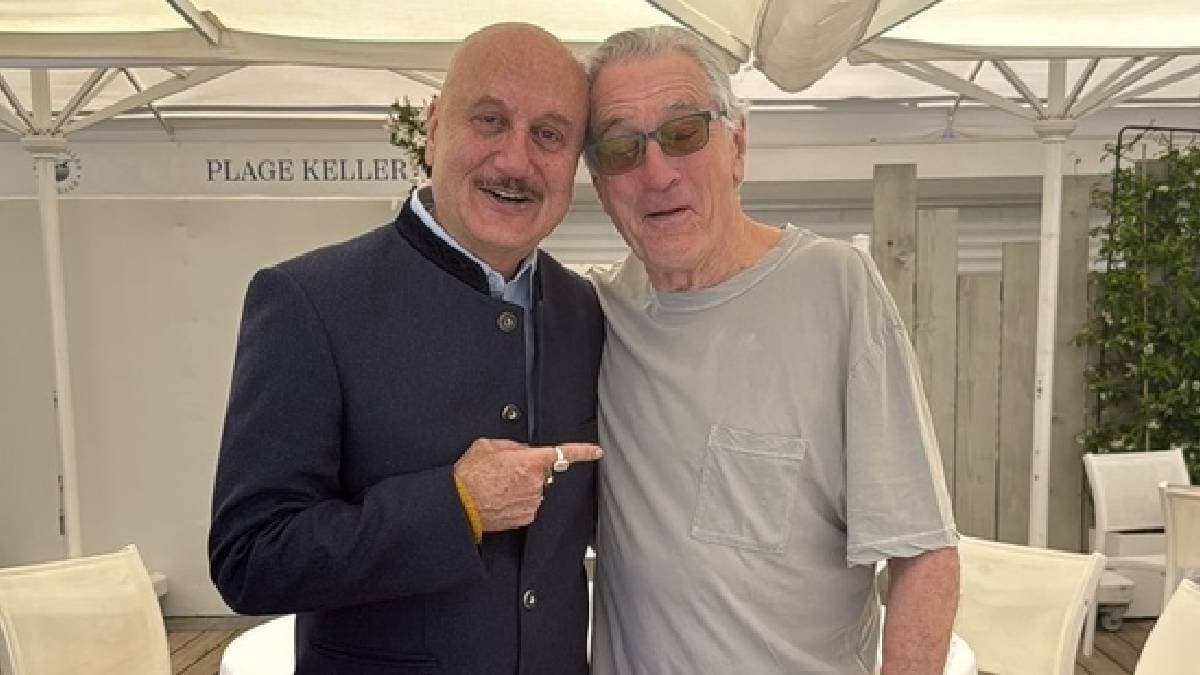 Robert De Niro hugs and kisses Anupam Kher at Cannes