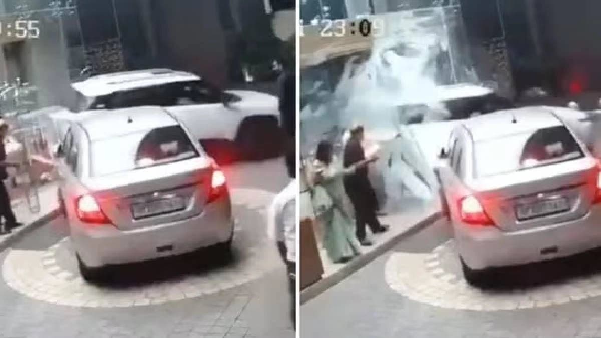 Woman crashes SUV into glass door while reversing as people run for cover