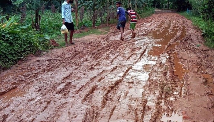 patient being taken to hospital on cot due to bad condition of road in this village 