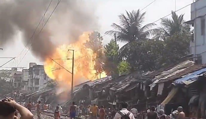 Fire at slum beside dhakuria station 