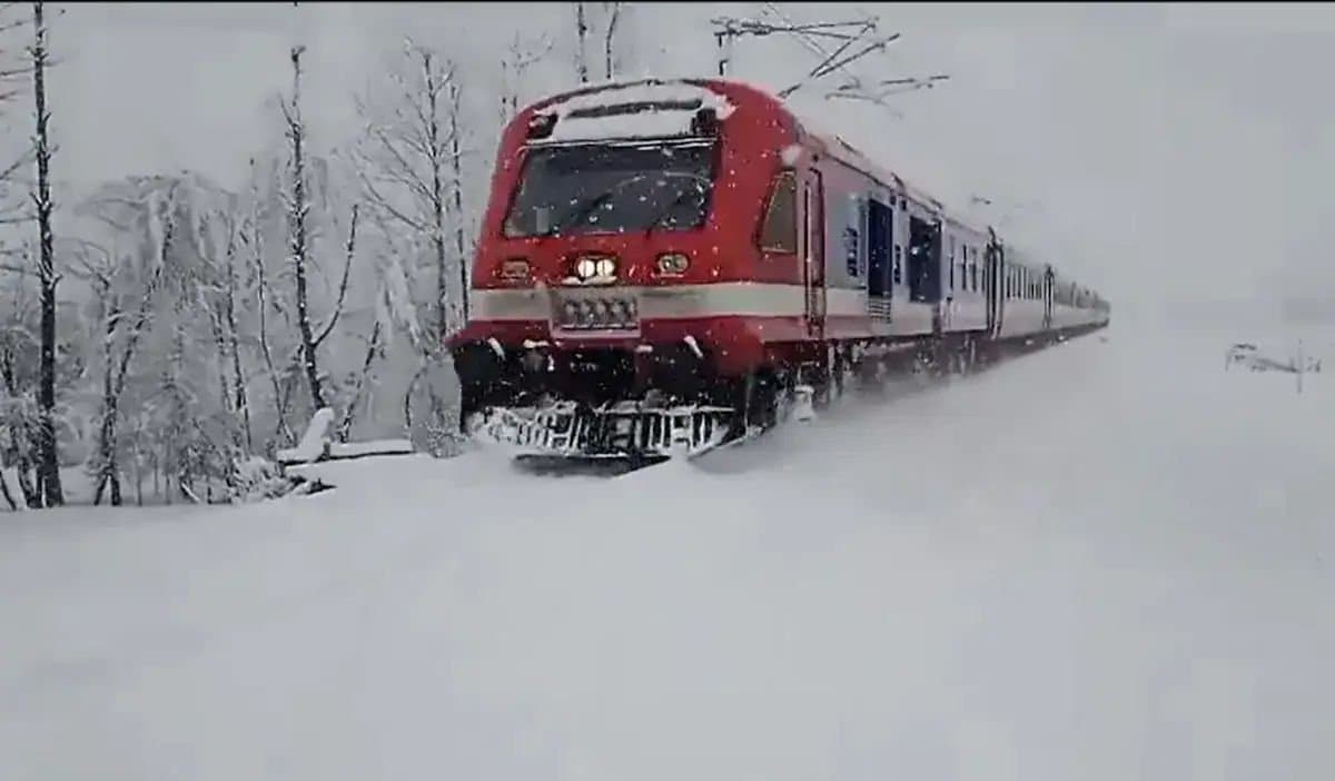 Train Running Amidst Snowfall In Kashmir