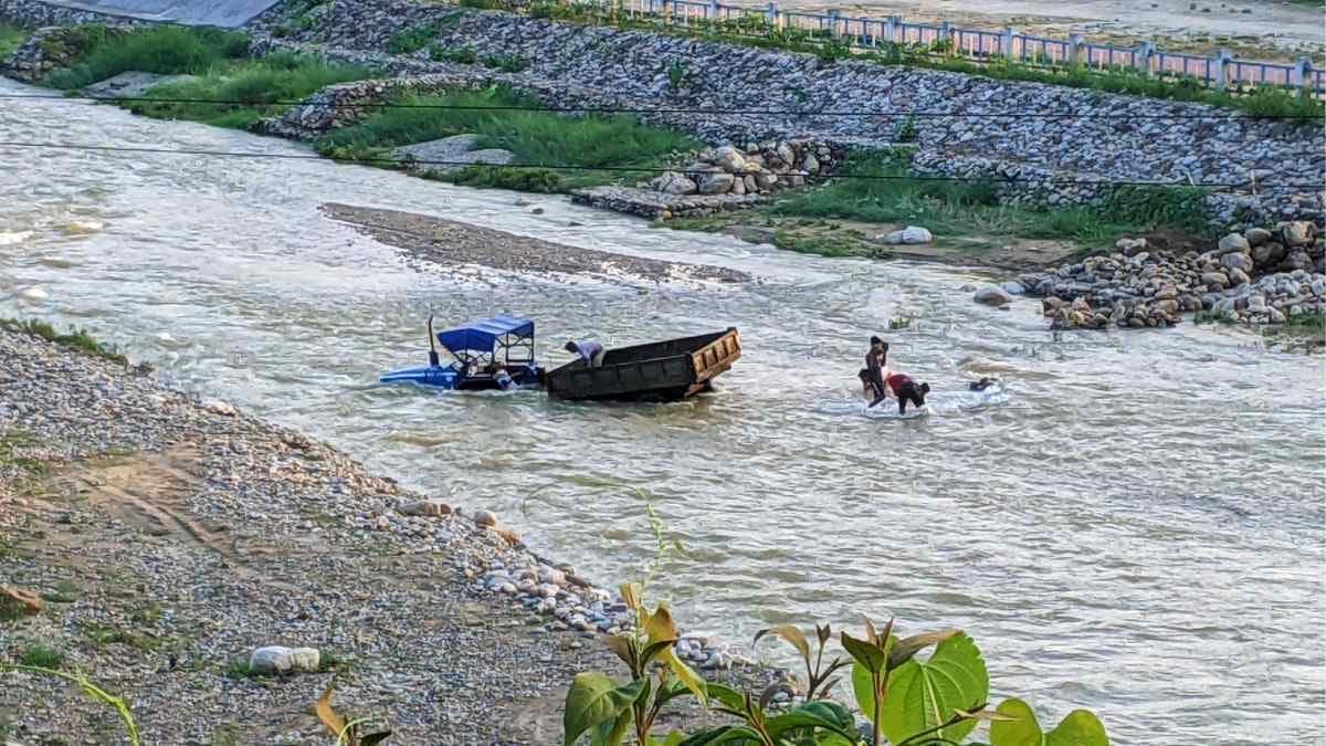 Flashing flood in Mal river swept away tractor