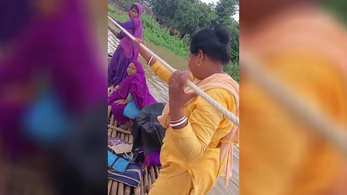 To cross river woman health workers are themselves sailing boat by drawing rope