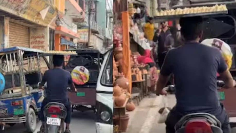 Bareilly Man Balances Samosa Tray On Head While Riding Tray In Narrow Lane 