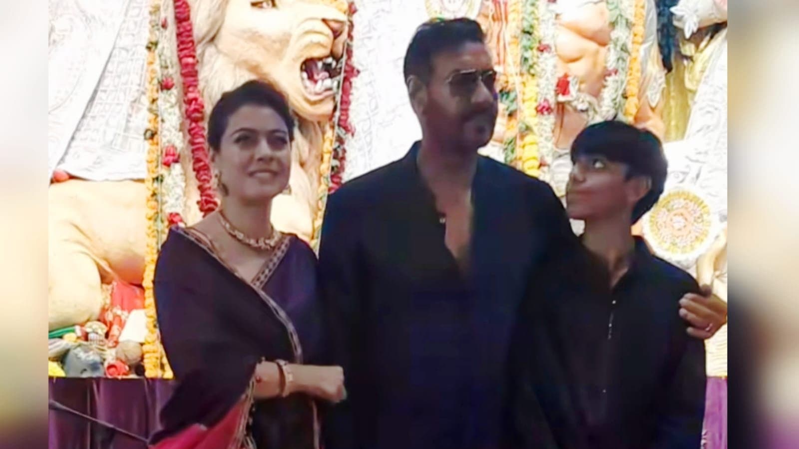 kajol playfully pinches ajay devgan as they pose during durga puja celebration ent