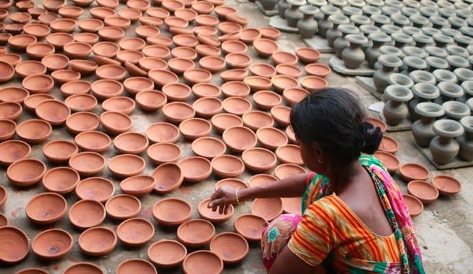 making of lamps in progress for kali pujo