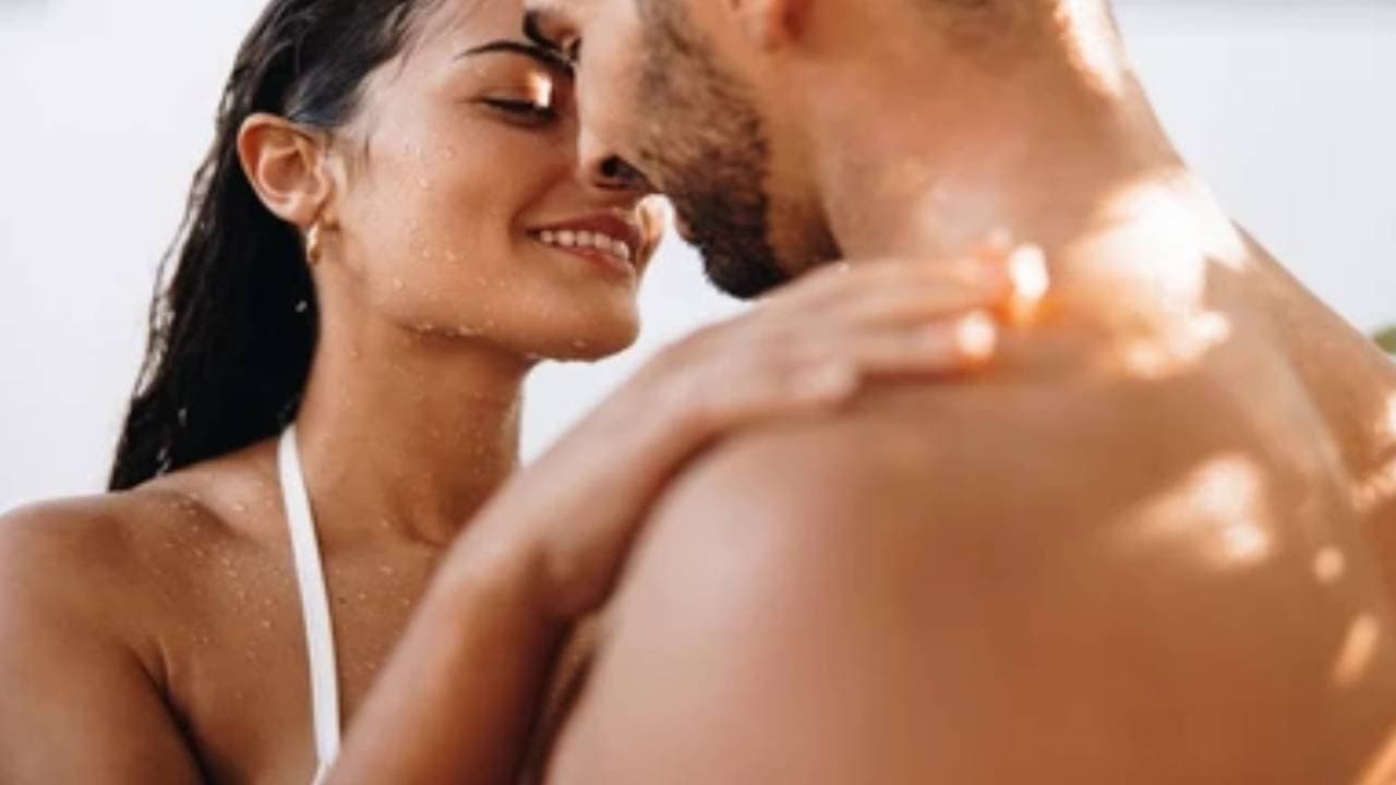 intimate couple taking shower together 