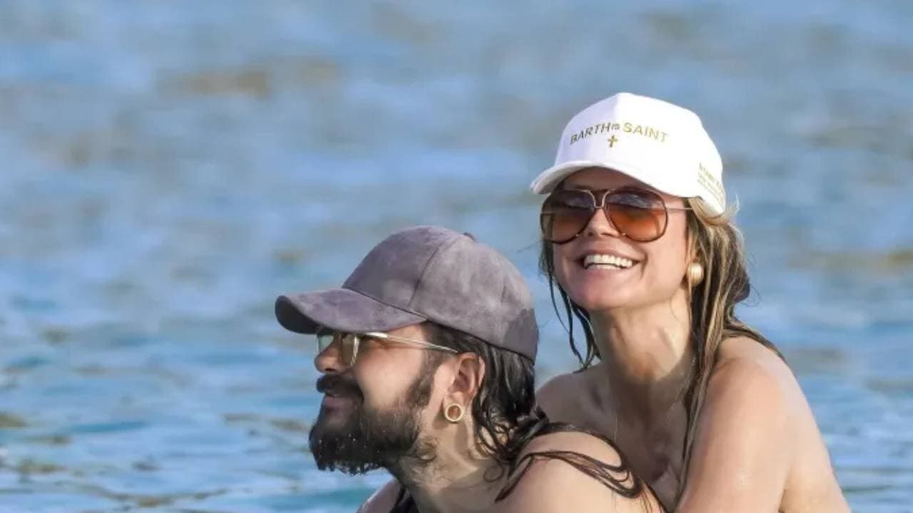 German super model heidi klum and husband packed on the PDA while swimming in the ocean