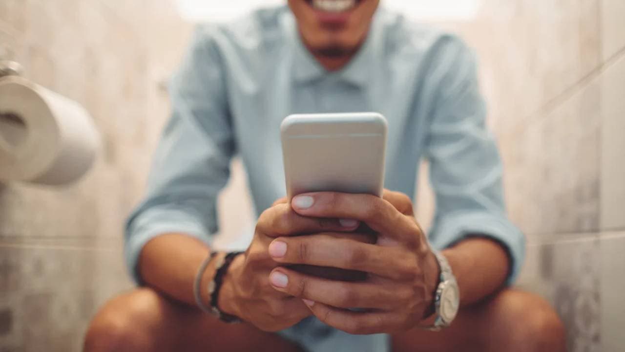 do not enter inside bathroom with mobile and spend time