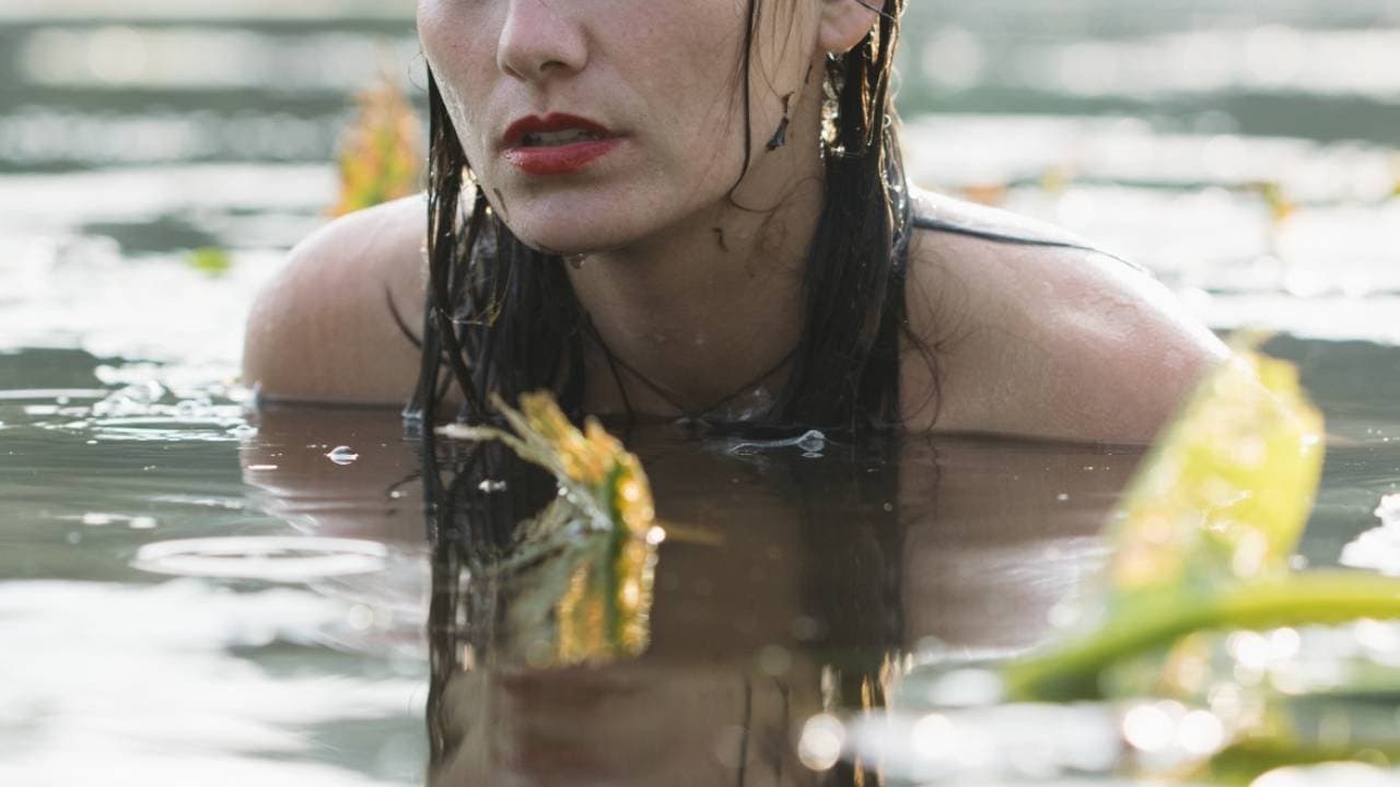 Lousina woman swims in neighbours pond in almost bare body