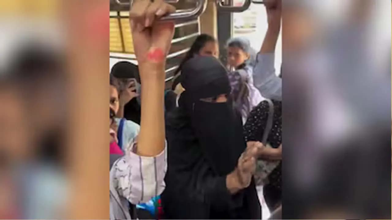 A man dressed in a burqa boarded the womens compartment of a local train in Mumbai Watch the video