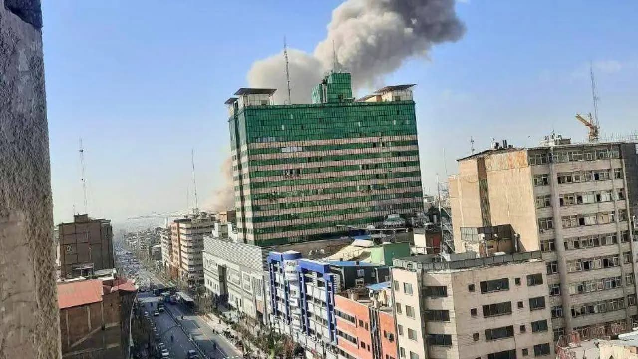 Smoke rises from a Tehran building after an earlier Israeli airstrike