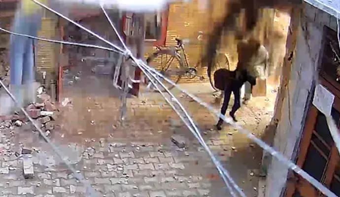 Roof Collapses On Woman, Child Walking In Street