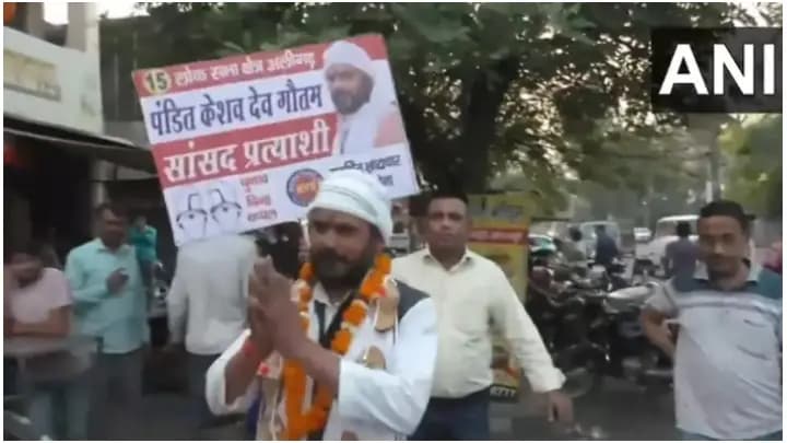 Candidate Seeks Vote With Garland Of Slippers Around His Neck