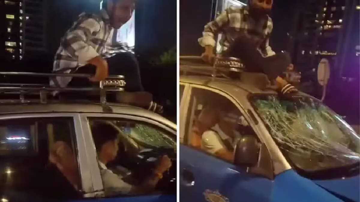 Man rides on top of taxi to stop driver from fleeing after crash mumbai Santa Cruz Flyover