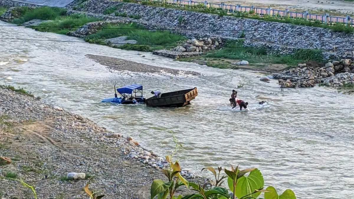 Flashing flood in Mal river swept away tractor