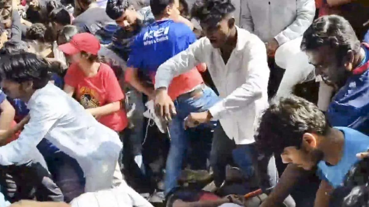 Father Holds On To Grave Of Son Killed In Stampede