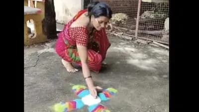 Woman creates a rangoli by effortlessly tossing powder gnr 