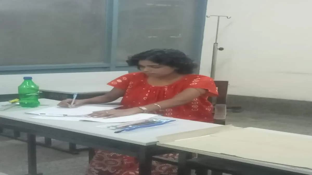 Cancer patient seats for exam from NRS Hospital