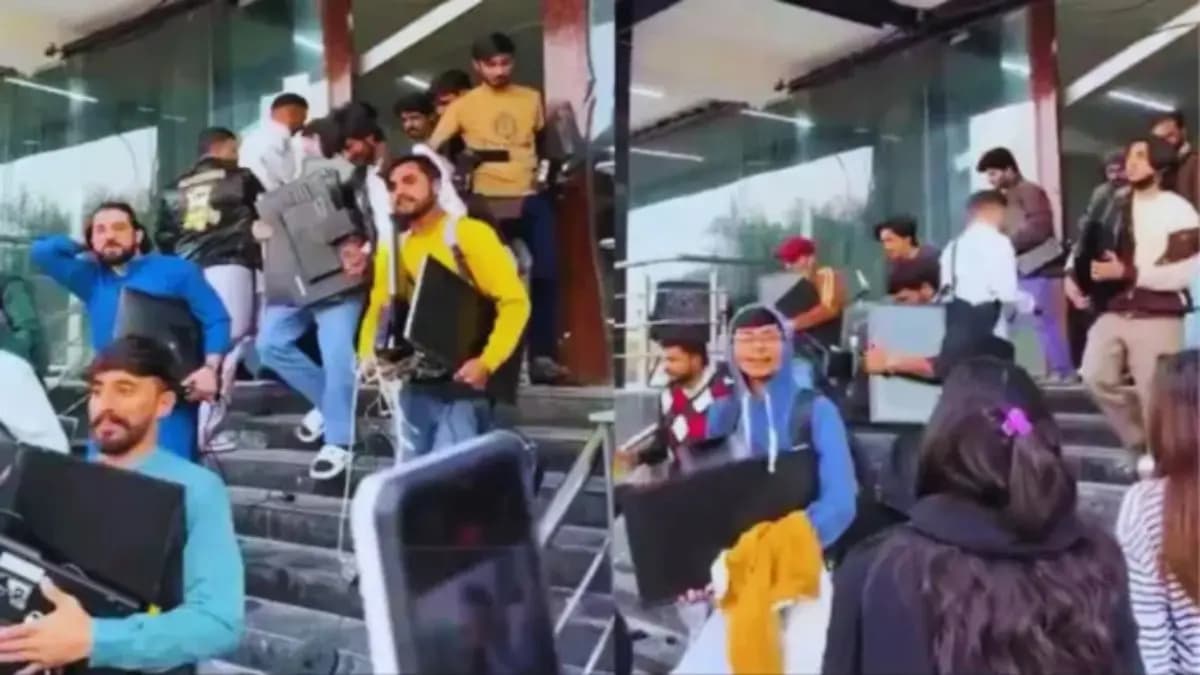 Mob looted monitor keyboard during raid in fake call centre in Pakistan