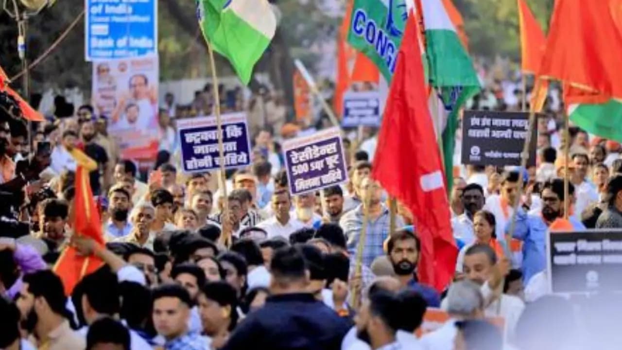 Thousands march in mumbai against adani group