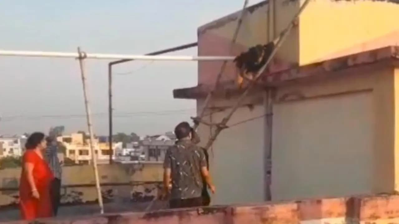 A couple intoxicated with a bottle of liquor in the middle of the water tank in uttarpara