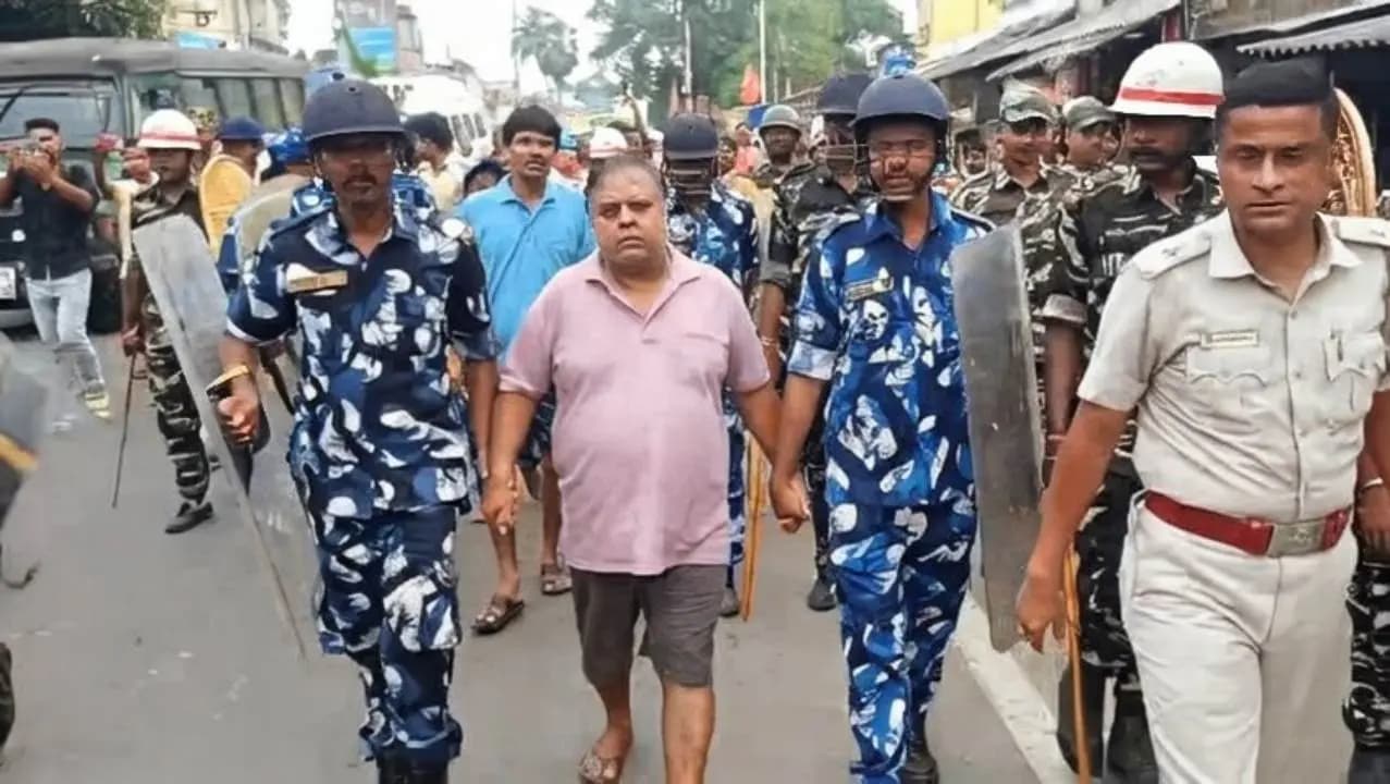 TMC Leader Arrested Police take arrested former Trinamool MLA for crime scene reconstruction, dressed in shorts 