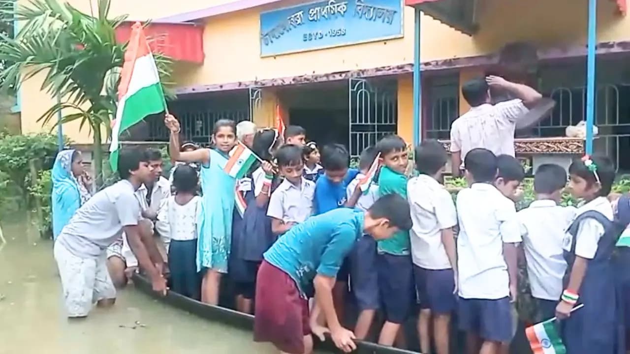 Independence Day 2026: Students of Sabangs Chandgobra Primary School watch national flag hoisting from a boat as school is flooded 