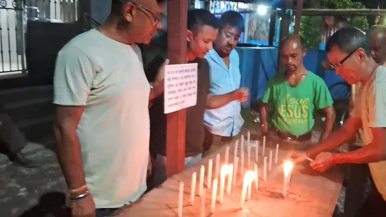 Paying respects to the dead in Nepal by lighting candles in Jalpaiguri