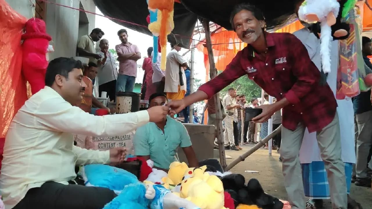  bjp mla Krishna Kanta Saha at the local Manasa Puja fair 
