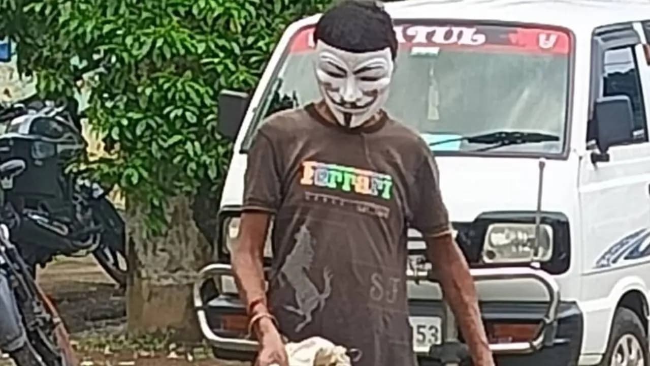 An unidentified young man is collecting plastic while wearing a mask on the Sabang Hospital premises