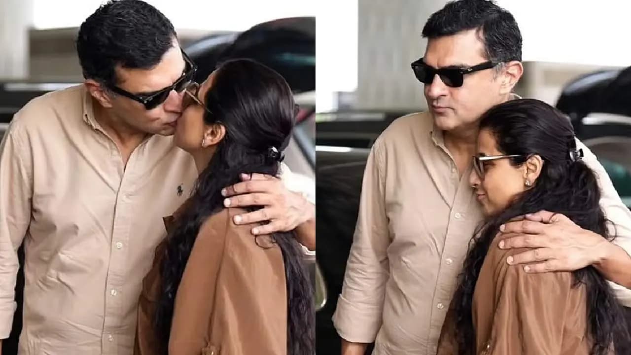 Vidya Balan kisses Husband Siddharth Roy Kapur at Mumbai Airport 