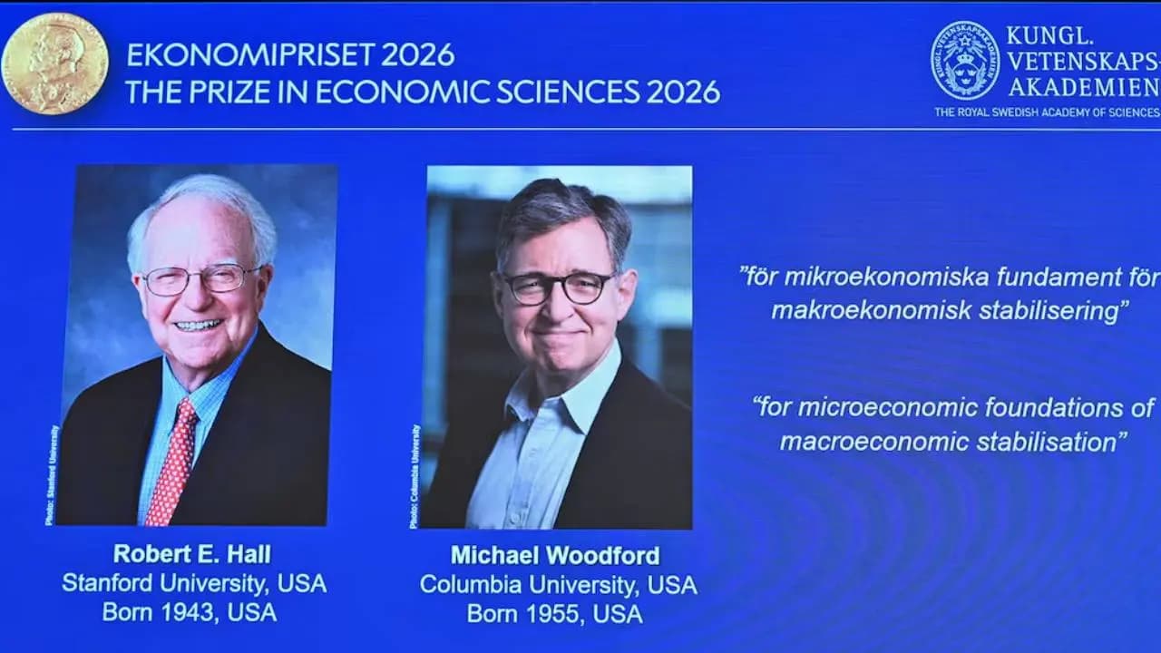 By solving which complex economic puzzle did Hall and Woodford win the Nobel Prize