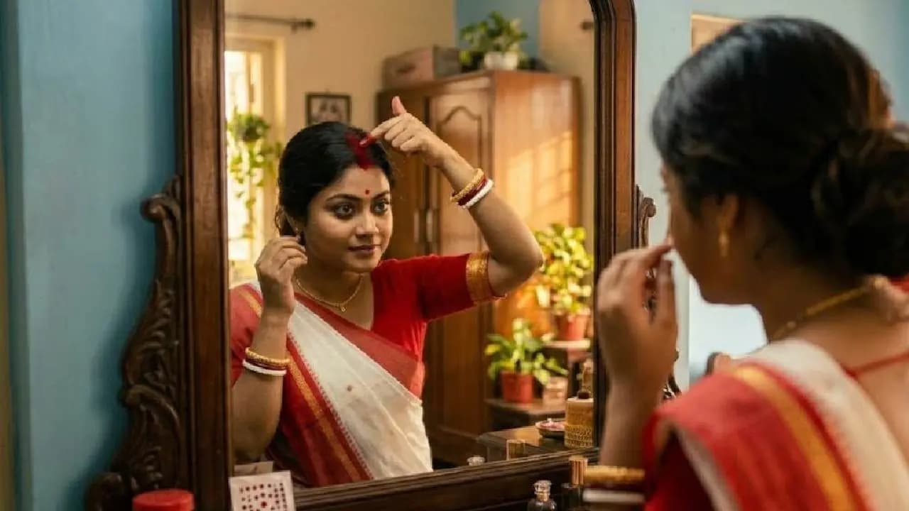 Applying sindoor