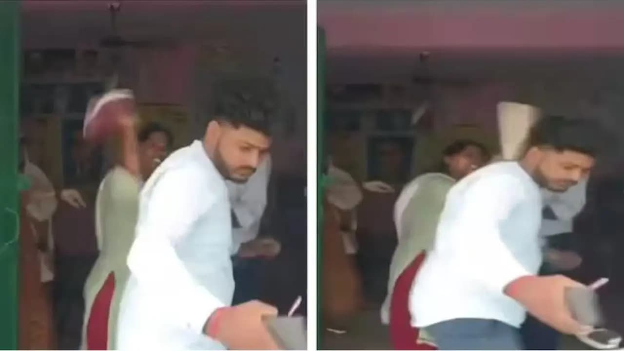 viral video of school teacher beating guardian in UP school